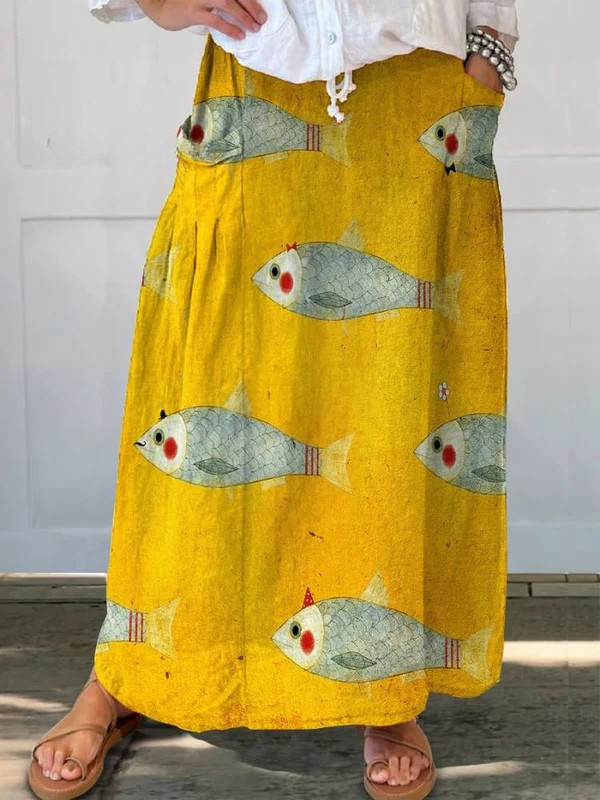 Elli™ vintage fish art print pocket skirt by THE WHITMORE FAMILY, yellow fabric with fish illustration and side pockets.