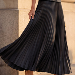 Yellow Rhodes structured bodice and pleated skirt set by THE WHITMORE FAMILY, featuring a fitted bodice and flowing pleated skirt.