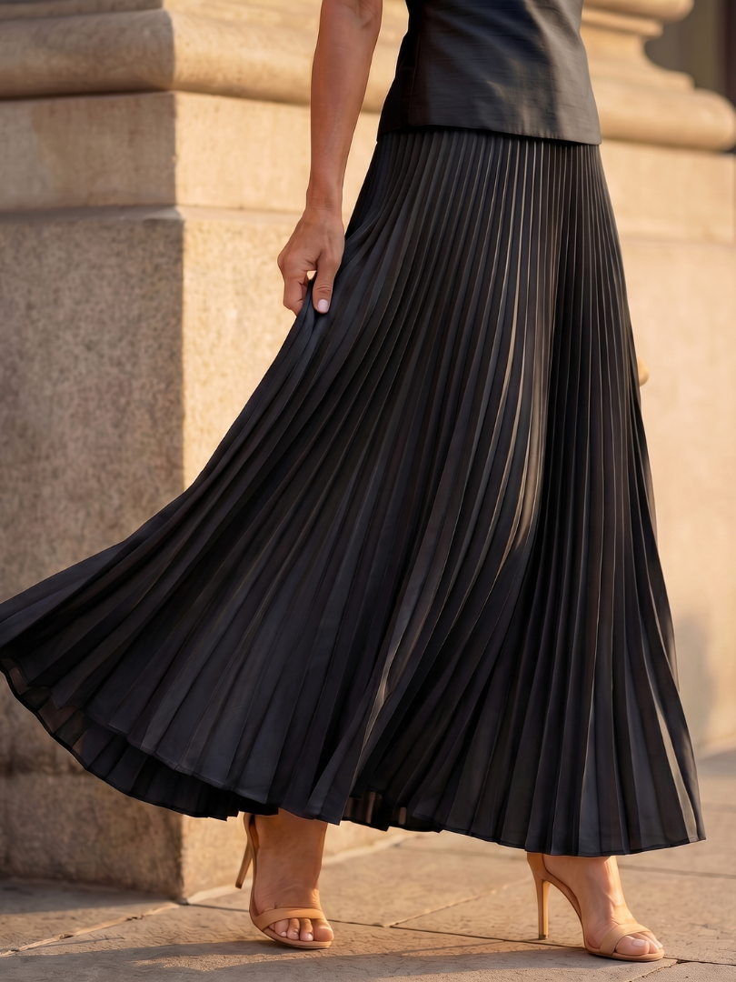 Yellow Rhodes structured bodice and pleated skirt set by THE WHITMORE FAMILY, featuring a fitted bodice and flowing pleated skirt.