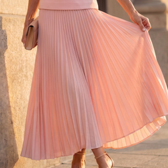 Yellow Rhodes structured bodice and pleated skirt set by THE WHITMORE FAMILY, with a fitted bodice and flowing pleated skirt.
