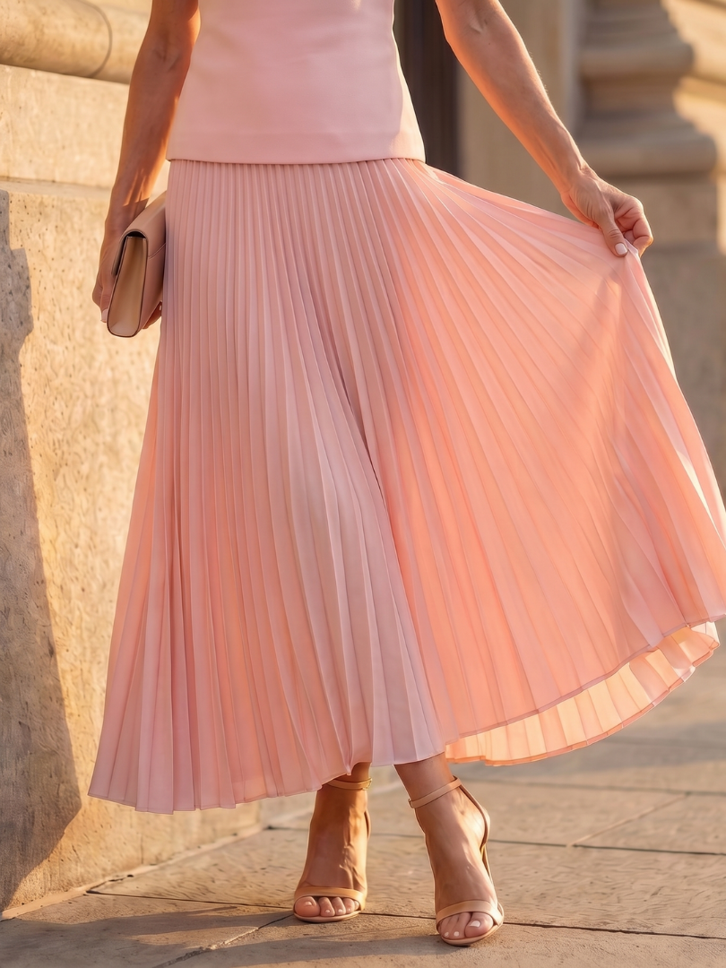Yellow Rhodes structured bodice and pleated skirt set by THE WHITMORE FAMILY, with a fitted bodice and flowing pleated skirt.