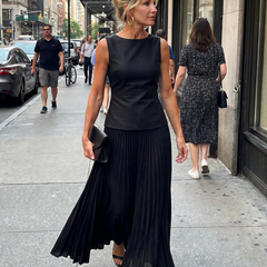 Yellow Rhodes structured bodice and pleated skirt set by THE WHITMORE FAMILY, featuring a fitted bodice and flowing pleated skirt.