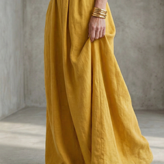 Yellow Wanda cross-front wide-leg jumpsuit by THE WHITMORE FAMILY, featuring a stylish cross-front design and wide-leg silhouette.