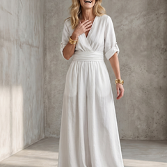 Yellow Wanda cross-front wide-leg jumpsuit by THE WHITMORE FAMILY, featuring a stylish front design and loose fit.