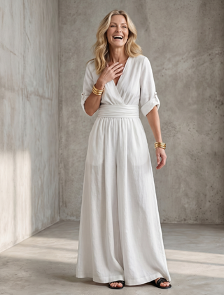 Yellow Wanda cross-front wide-leg jumpsuit by THE WHITMORE FAMILY, featuring a stylish front design and loose fit.