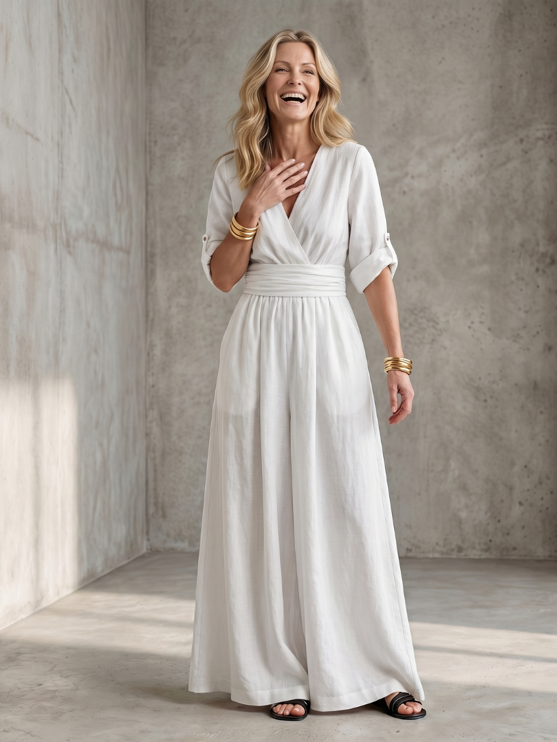 Yellow Wanda cross-front wide-leg jumpsuit by THE WHITMORE FAMILY, featuring a stylish front design and loose fit.