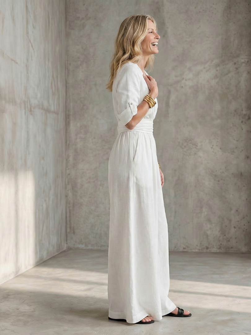 Yellow Wanda cross-front wide leg jumpsuit by THE WHITMORE FAMILY, featuring a stylish front design and wide-leg silhouette.