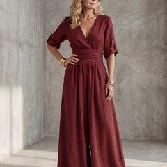 Yellow Wanda cross-front wide-leg jumpsuit from THE WHITMORE FAMILY, featuring a stylish front design and relaxed fit.
