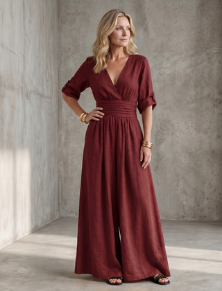 Yellow Wanda cross-front wide-leg jumpsuit from THE WHITMORE FAMILY, featuring a stylish front design and relaxed fit.