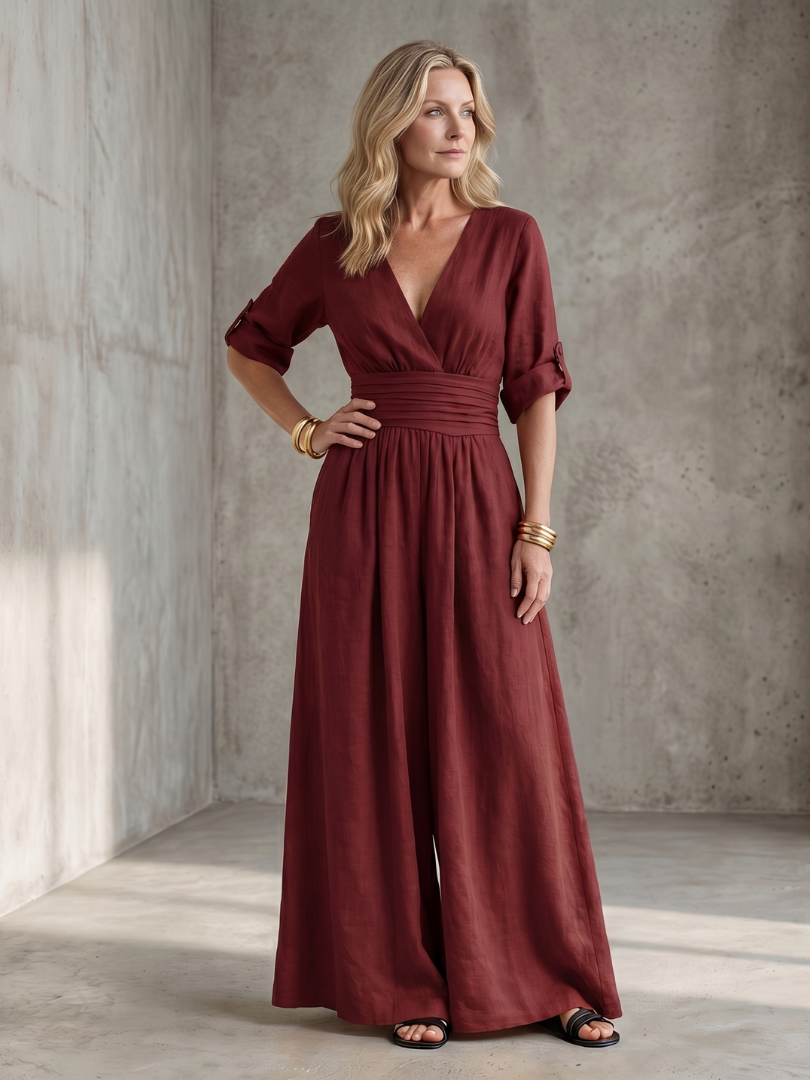 Yellow Wanda cross-front wide-leg jumpsuit from THE WHITMORE FAMILY, featuring a stylish front design and relaxed fit.