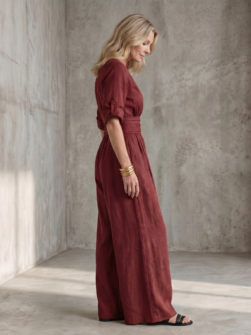 Yellow Wanda cross-front wide leg jumpsuit by THE WHITMORE FAMILY, featuring a stylish cross-front design and flowy wide-leg style.