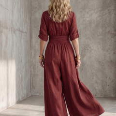 Yellow Wanda cross-front wide-leg jumpsuit by THE WHITMORE FAMILY, featuring a stylish front design and flowy wide-leg silhouette.