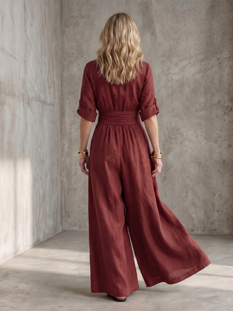 Yellow Wanda cross-front wide-leg jumpsuit by THE WHITMORE FAMILY, featuring a stylish front design and flowy wide-leg silhouette.