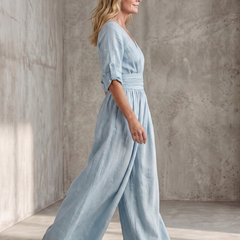 Yellow Wanda cross-front wide-leg jumpsuit by THE WHITMORE FAMILY, featuring a stylish front design and flowing wide-leg silhouette.