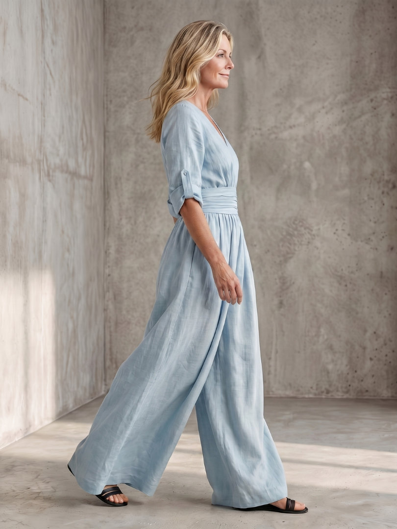 Yellow Wanda cross-front wide-leg jumpsuit by THE WHITMORE FAMILY, featuring a stylish front design and flowing wide-leg silhouette.