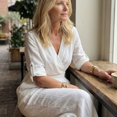 Yellow Wanda cross-front wide-leg jumpsuit by THE WHITMORE FAMILY, featuring a stylish front design and wide-leg silhouette.