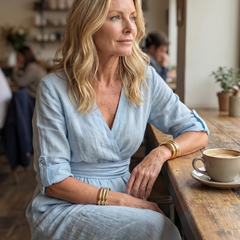 Yellow Wanda cross-front wide-leg jumpsuit by THE WHITMORE FAMILY, featuring a stylish front design and flowing wide-leg silhouette.