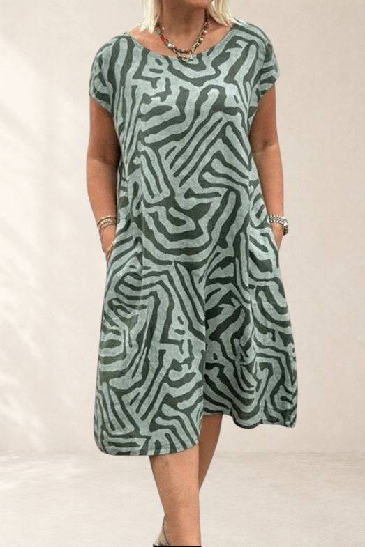 Calyviah comfortable sage zebra-print dress by THE WHITMORE FAMILY featuring an A-line silhouette with pockets and stylish pattern.