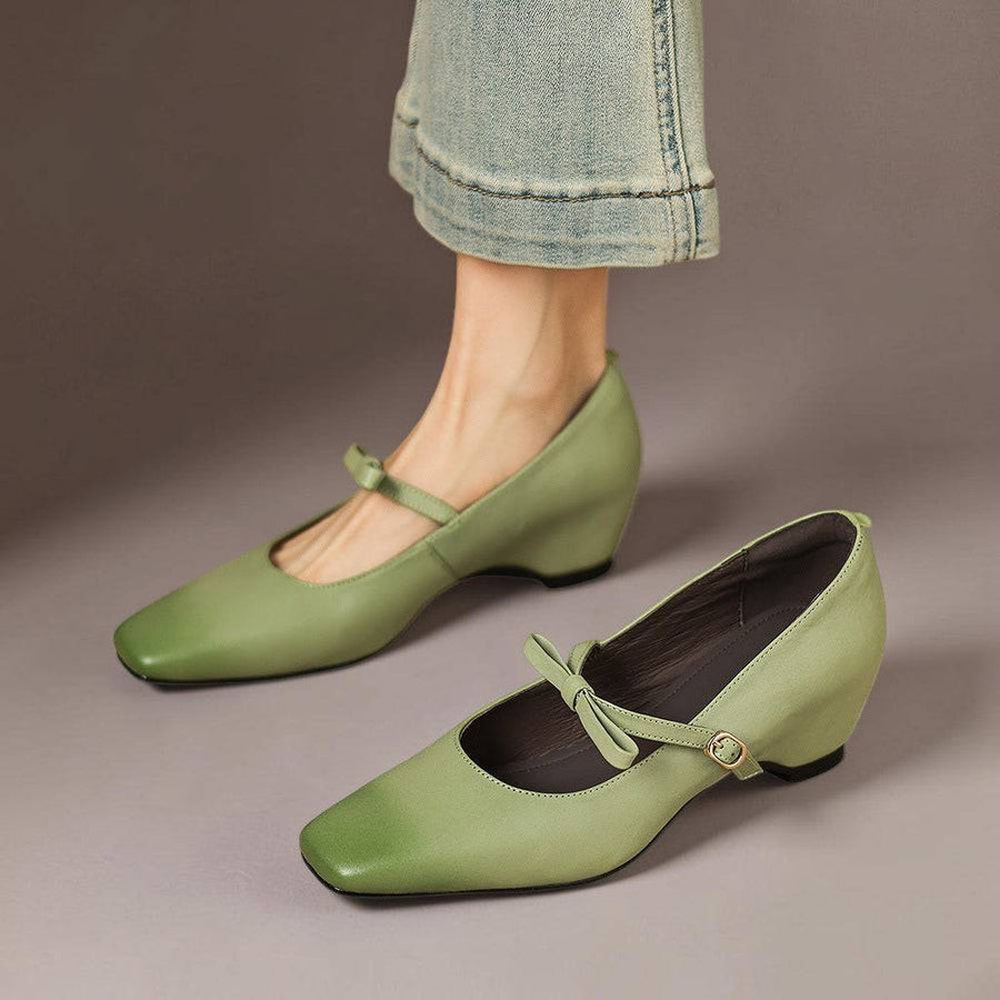 Green leather Bryony Bow-Strap Mary Jane Pumps by THE WHITMORE FAMILY with a classic pump design and decorative bow strap.