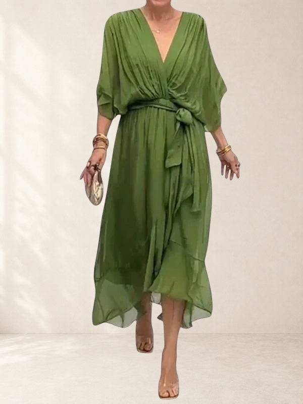 Elegant green wrap dress from THE WHITMORE FAMILY's Bethany collection, featuring a flattering silhouette and stylish design.