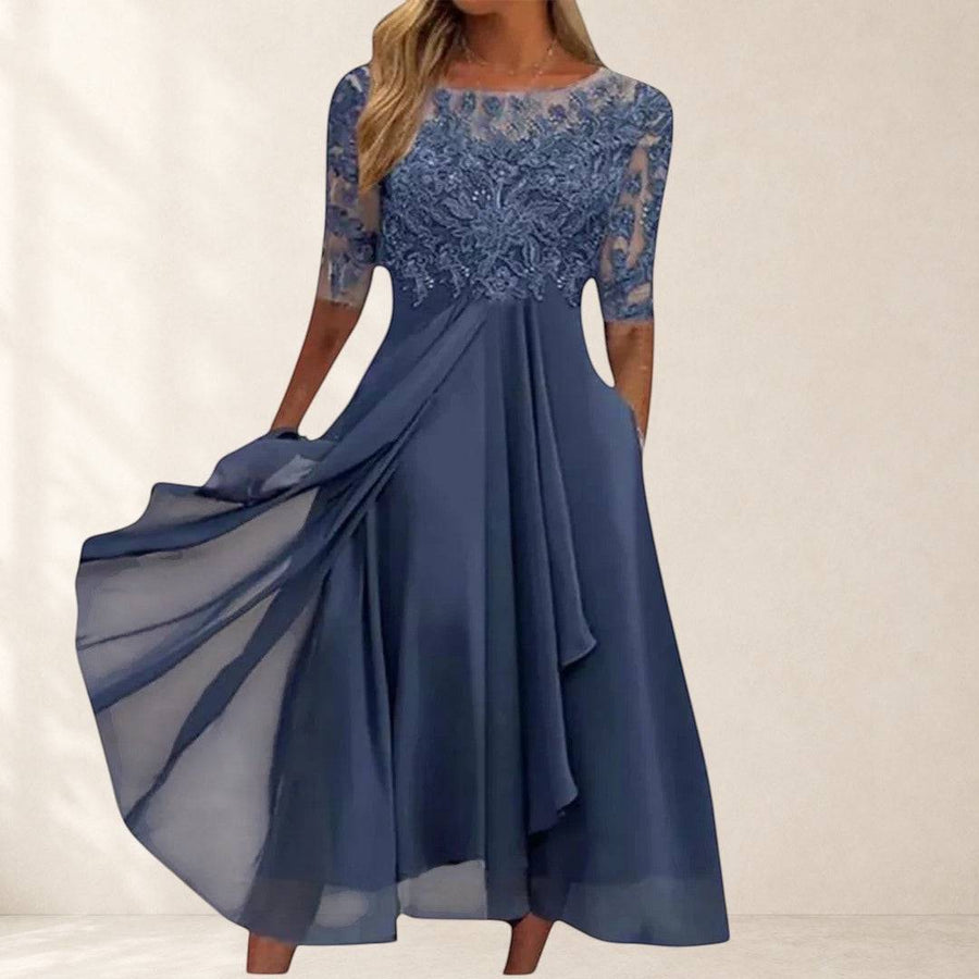 Navy lace chiffon dress named Rhonda from THE WHITMORE FAMILY featuring elegant lace details and a flowing silhouette.