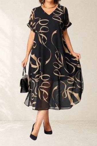 NORA black and gold print elegant dress by THE WHITMORE FAMILY, featuring a stylish, cozy design with intricate gold detailing.