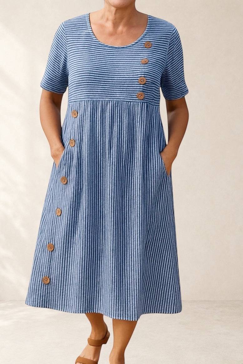 Blue and white striped midi dress by THE WHITMORE FAMILY featuring button details and pockets, perfect for everyday comfort.