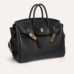 Black The Eleanor Weekender bag by THE WHITMORE FAMILY, showing its three-quarter view with handles and spacious design.