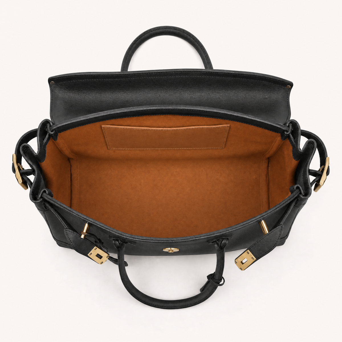 Interior view of THE WHITMORE FAMILY Eleanor Weekender bag showing spacious compartments and black fabric interior.