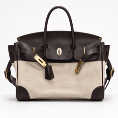The Eleanor Weekender bag by THE WHITMORE FAMILY, featuring a front view with leather accents and spacious design for travel.