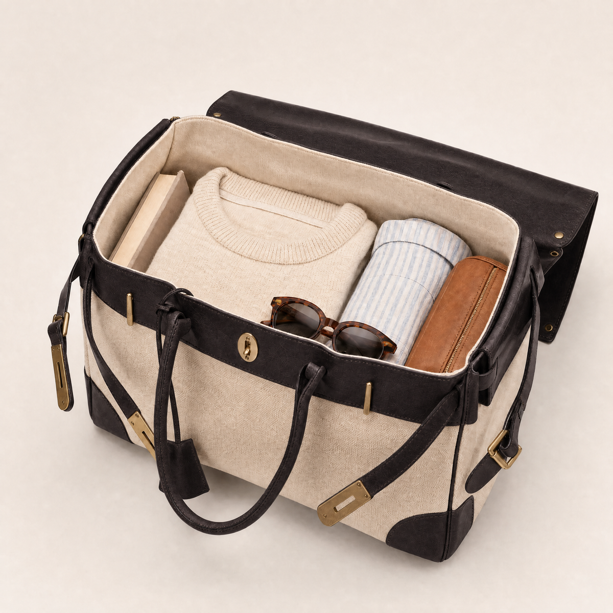 THE WHITMORE FAMILY Eleanor Weekender bag with black leather accents and spacious interior, ideal for travel or weekend trips.