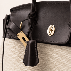 The Eleanor Weekender bag by THE WHITMORE FAMILY featuring hardware accents and a spacious design for travel or weekend use.